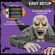 outdoor halloween decoration featuring zombie
