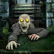 outdoor halloween decoration featuring zombie