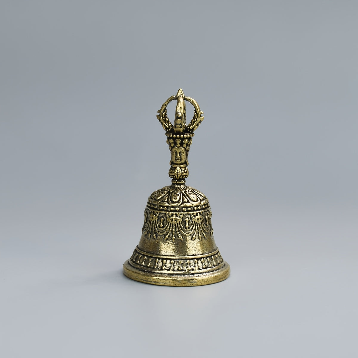 one carved bronze bell hand held shaker clapping handle